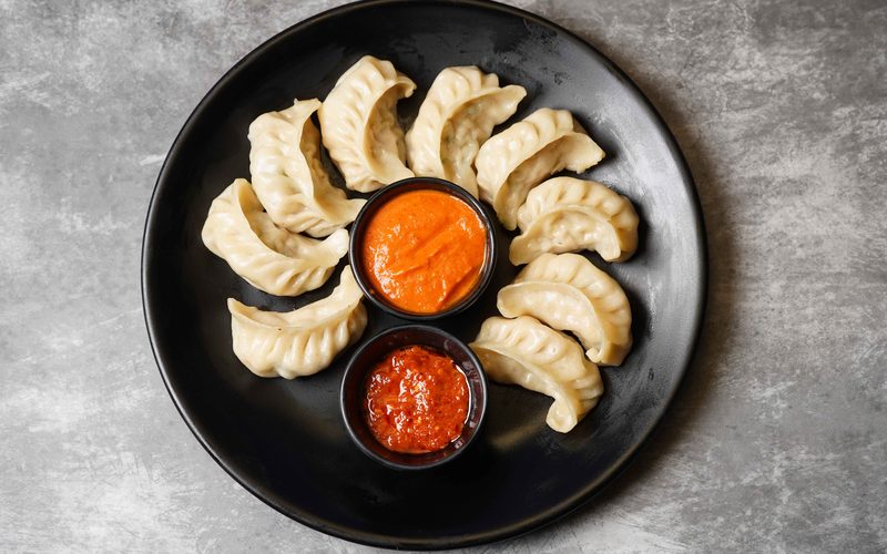 Steamed Momo with dipping sauces